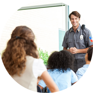 security officer talking to elementary class